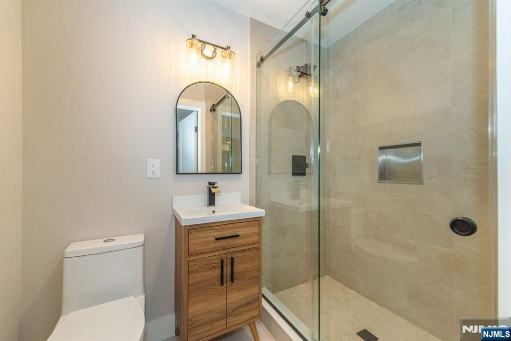 43 Alexander Avenue Montclair, NJ 07043 - Photo 39 of 50 a bathroom with a toilet sink and shower