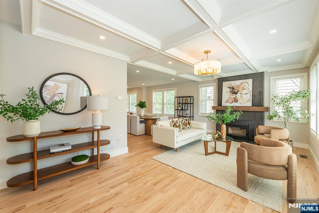 43 Alexander Avenue Montclair, NJ 07043 - Photo 5 of 50 a living room with furniture a mirror and wooden floor