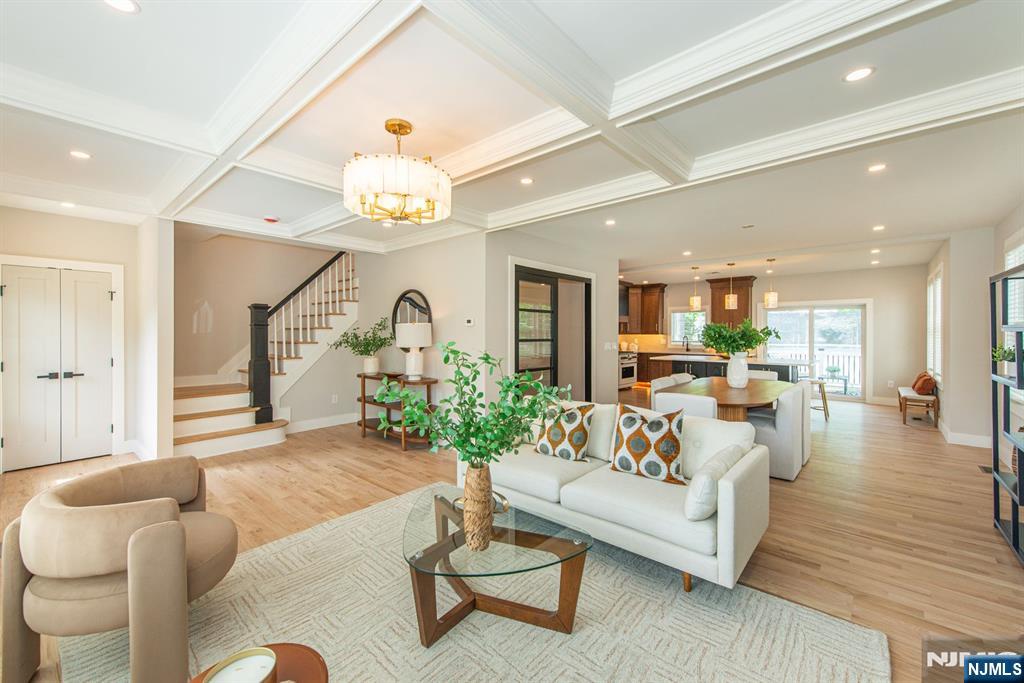 43 Alexander Avenue Montclair, NJ 07043 - Photo 6 of 50 a living room with furniture and a chandelier