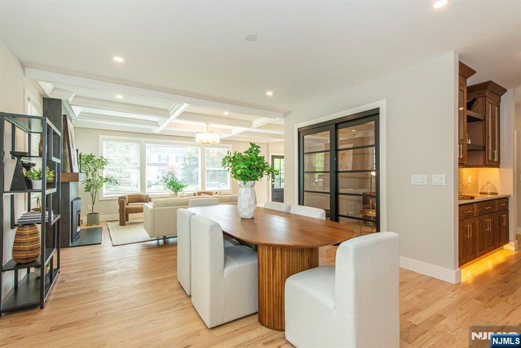 43 Alexander Avenue Montclair, NJ 07043 - Photo 9 of 50 a living room with couches a dining table and chairs with wooden floor