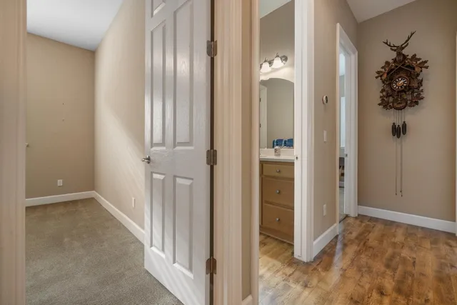 a bathroom with a sink and mirror with toilet