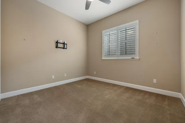 a bathroom with a double vanity sink toilet and shower