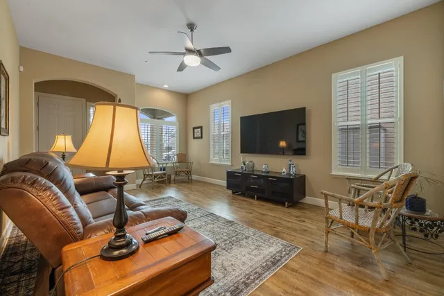 a dining room with furniture and wooden floor