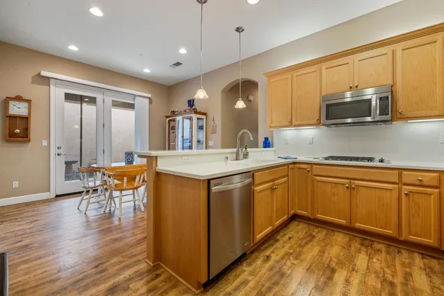 a spacious bathroom with a double vanity sink and a mirror