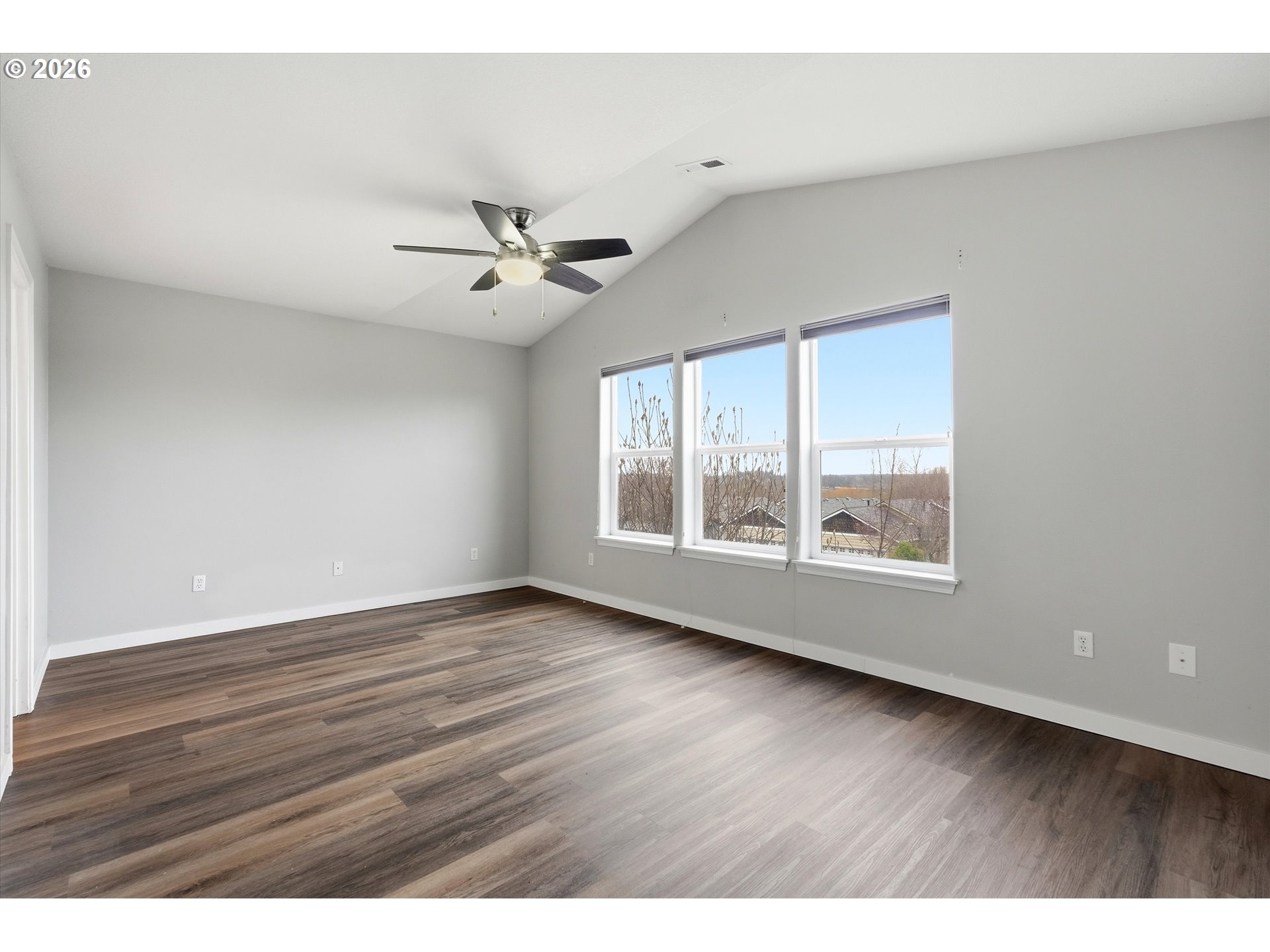 3130 Northwest Pacific Rim Drive Camas, WA 98607 - Photo 14 of 33 a view of an empty room with wooden floor and a window