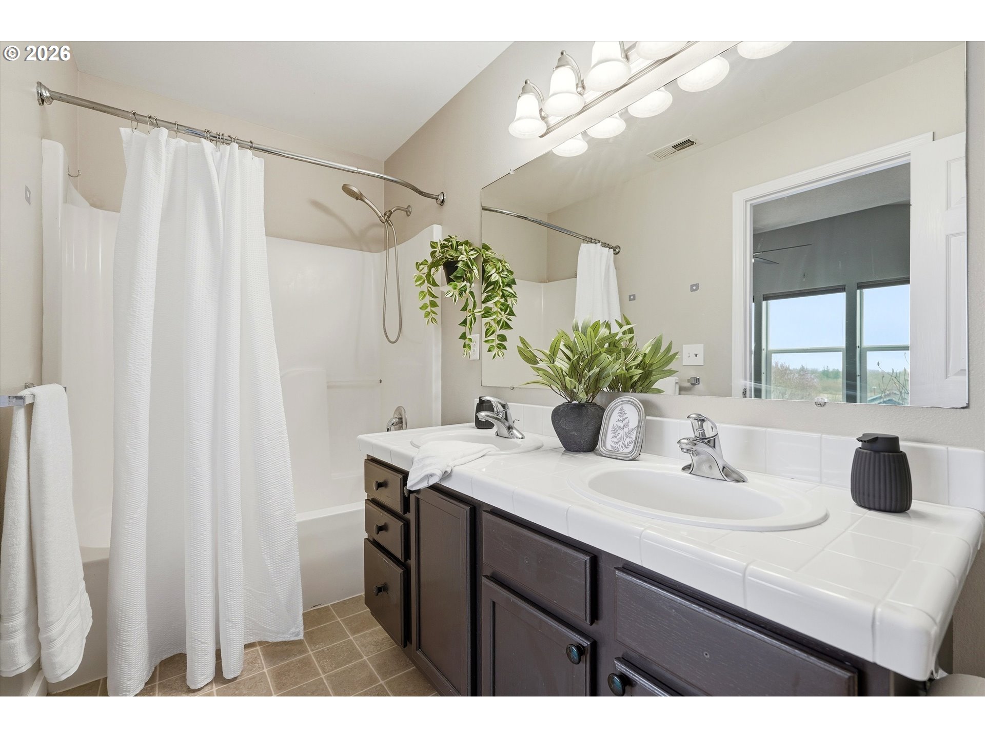 3130 Northwest Pacific Rim Drive Camas, WA 98607 - Photo 16 of 33 a bathroom with a sink vanity and a mirror