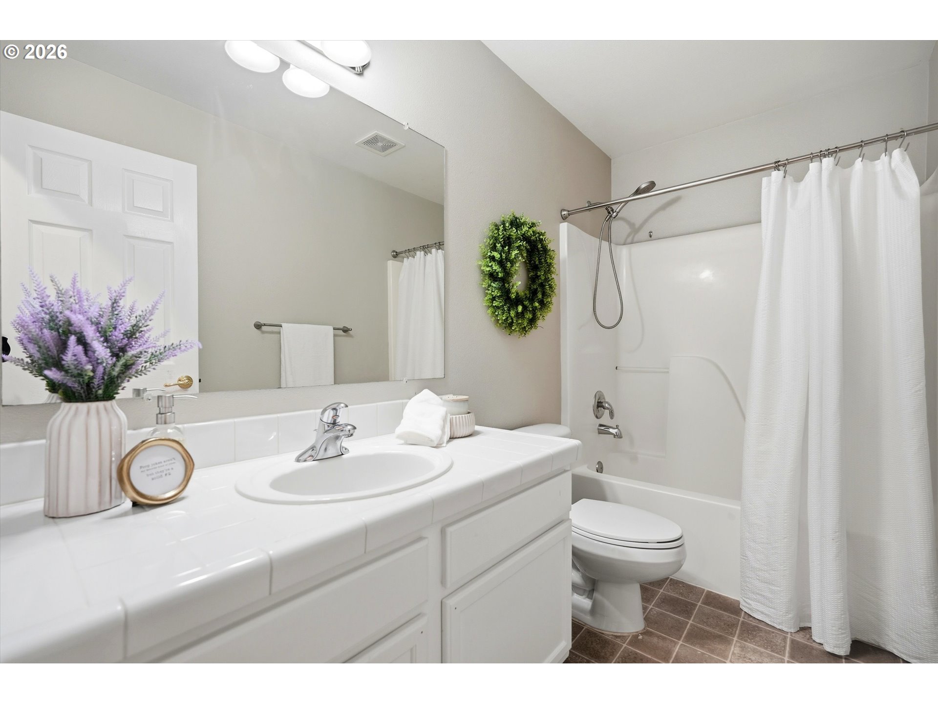 3130 Northwest Pacific Rim Drive Camas, WA 98607 - Photo 20 of 33 a bathroom with a sink a toilet and a shower curtain