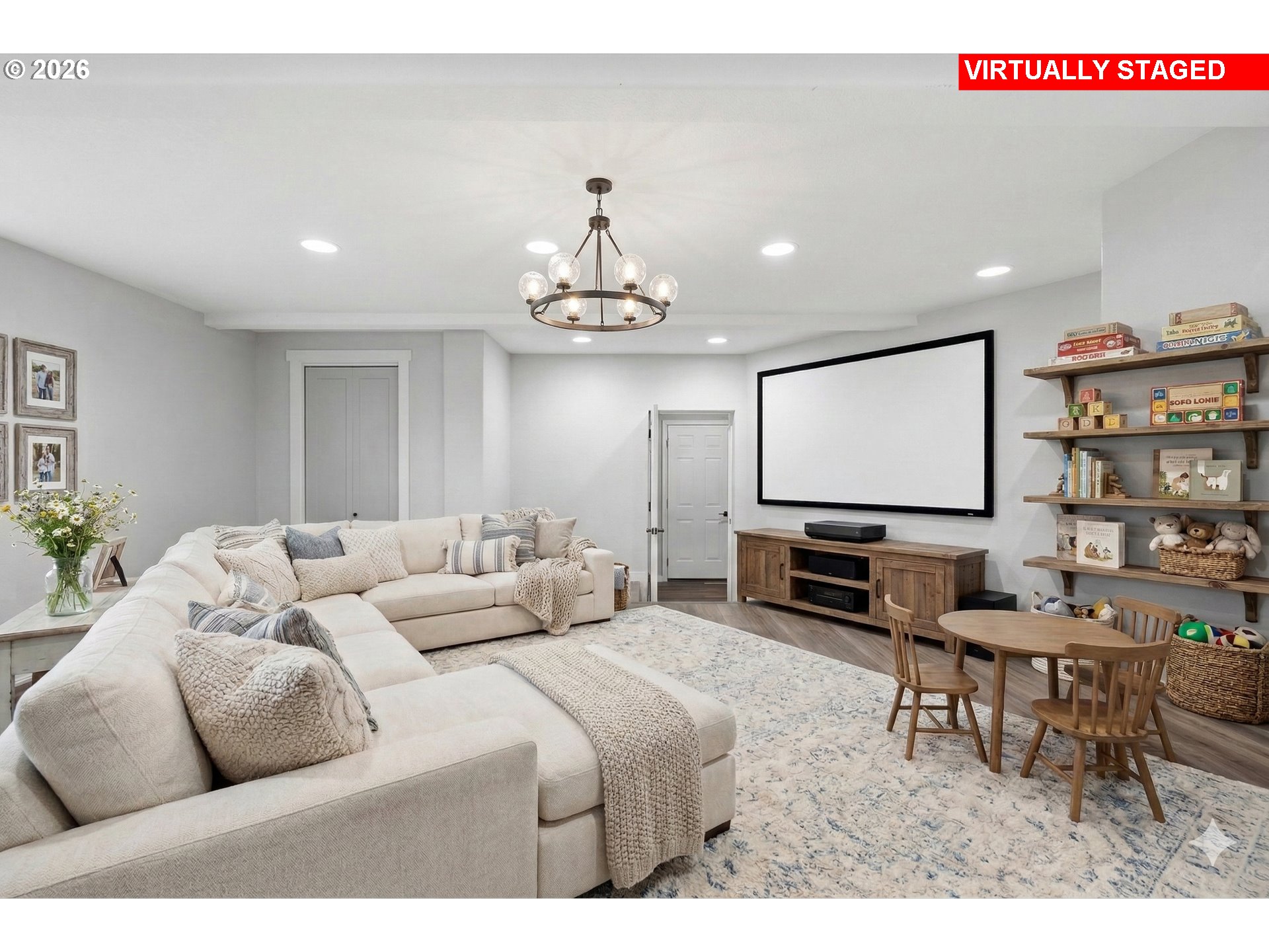 3130 Northwest Pacific Rim Drive Camas, WA 98607 - Photo 22 of 33 a living room with furniture a chandelier and a flat screen tv