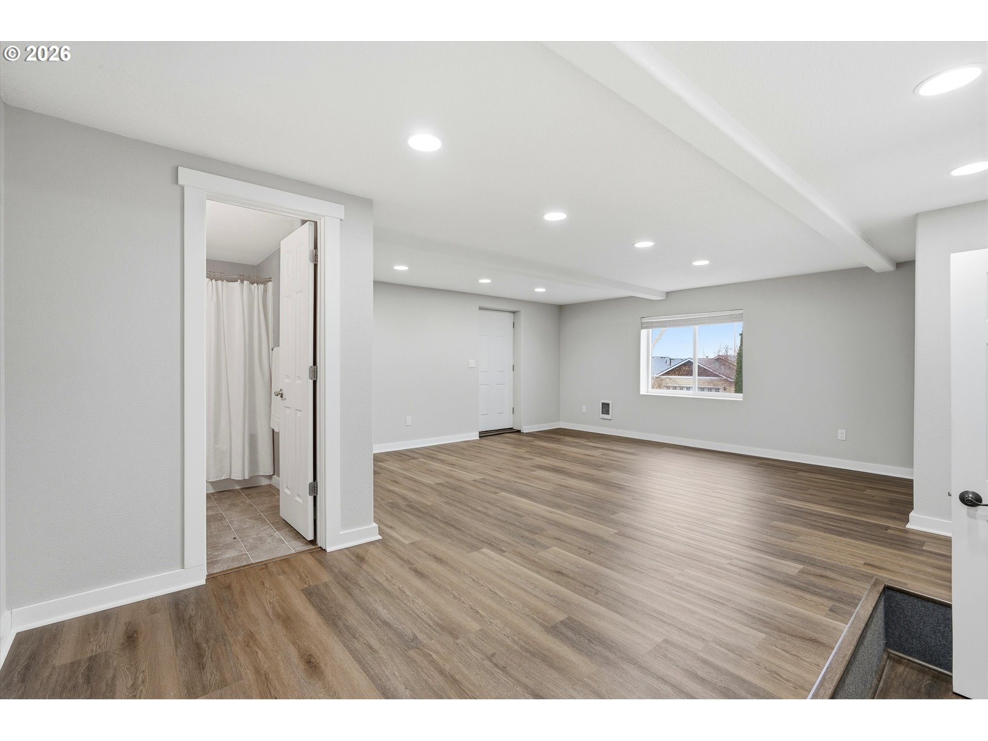3130 Northwest Pacific Rim Drive Camas, WA 98607 - Photo 24 of 33 a view of an empty room with wooden floor and a window