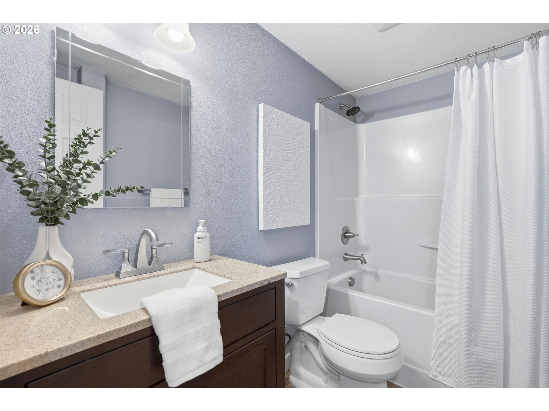 3130 Northwest Pacific Rim Drive Camas, WA 98607 - Photo 25 of 33 a bathroom with a sink toilet a mirror and shower