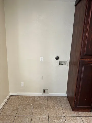 a view of an empty room and wooden floor