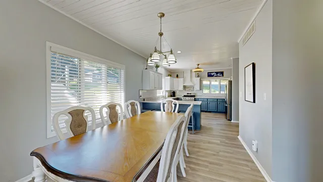 a dining room with furniture and window