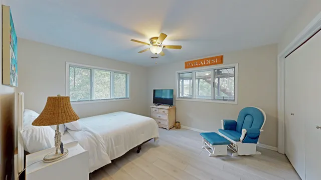 a bedroom with a bed and window