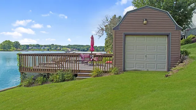 an aerial view of a house with a lake view