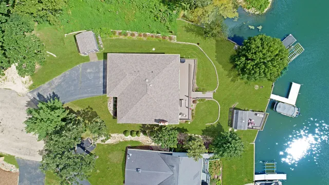 a front view of house with a garden