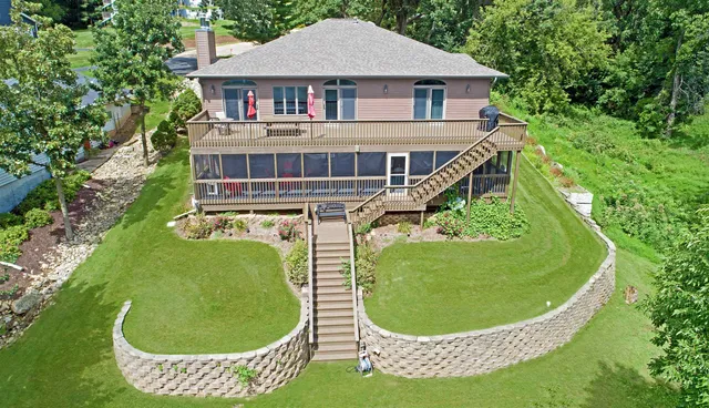 a view of a chair and table in the garden