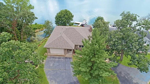 an outdoor sitting area with a table and chairs