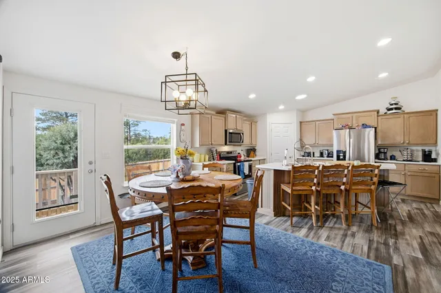 a living room with furniture a rug and a window