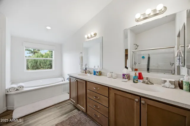 a spacious bedroom with a bed and a couch