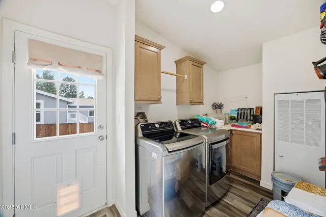 a bedroom with a bed and a lamp on dresser