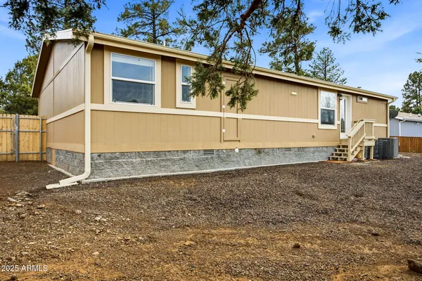 a view of outdoor space with deck and trees