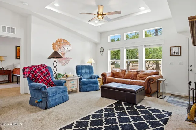 a living room with furniture a window and a fireplace