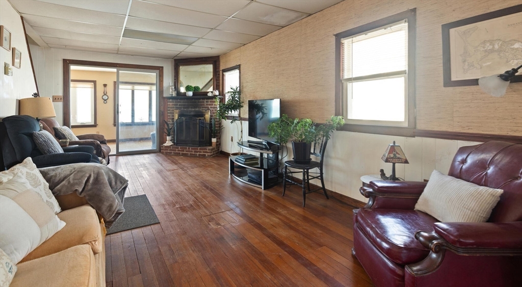 55 Castle Road Nahant, MA 01908 - Photo 14 of 32 a living room with furniture and wooden floor