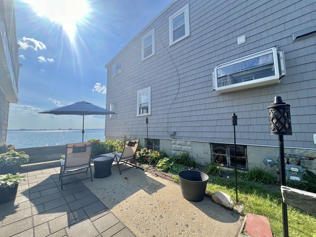 55 Castle Road Nahant, MA 01908 - Photo 22 of 32 a view of a patio with chairs and potted plants