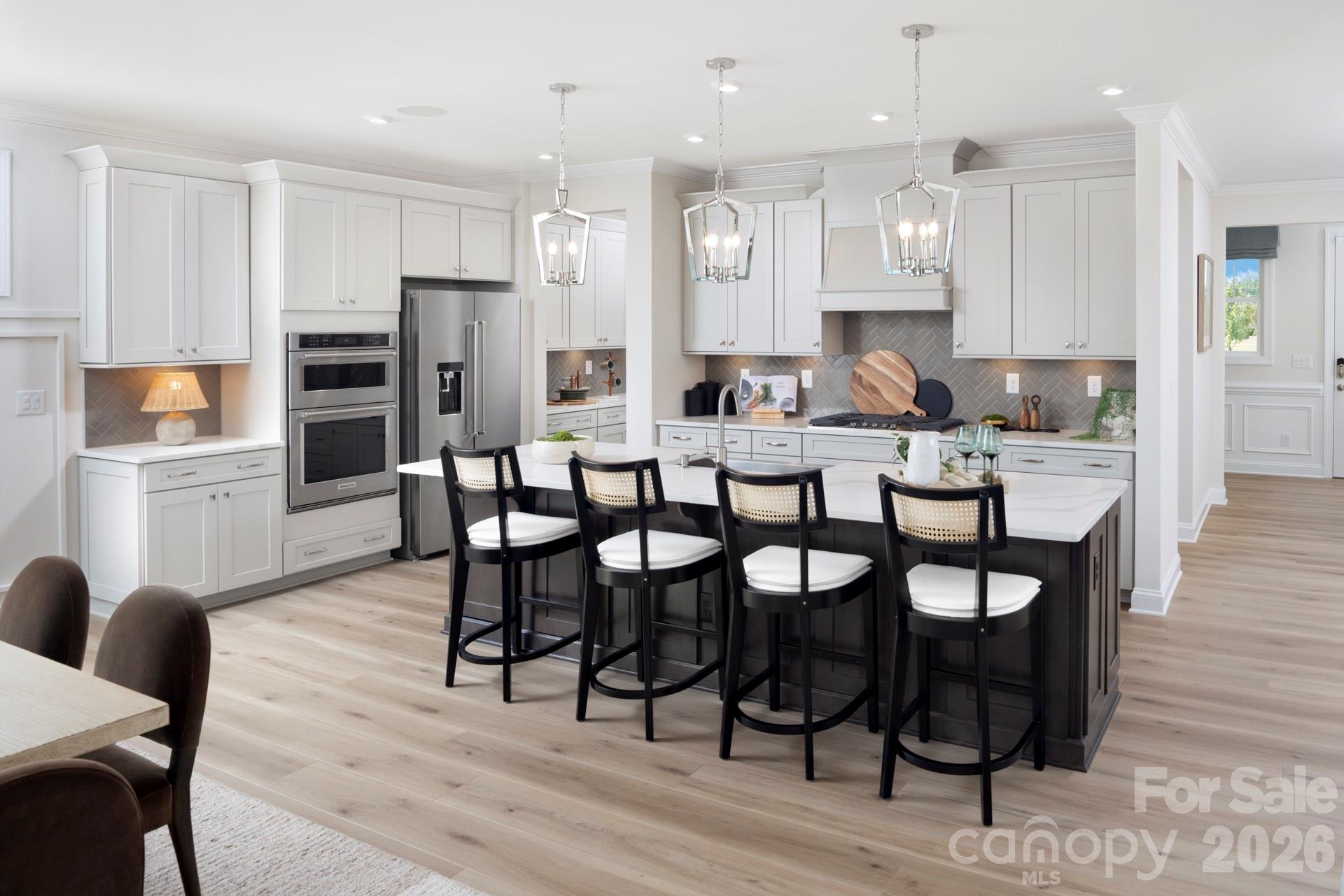 2532 Mabel Lane Monroe, NC 28110 - Photo 19 of 35 a view of a dining room with furniture and wooden floor