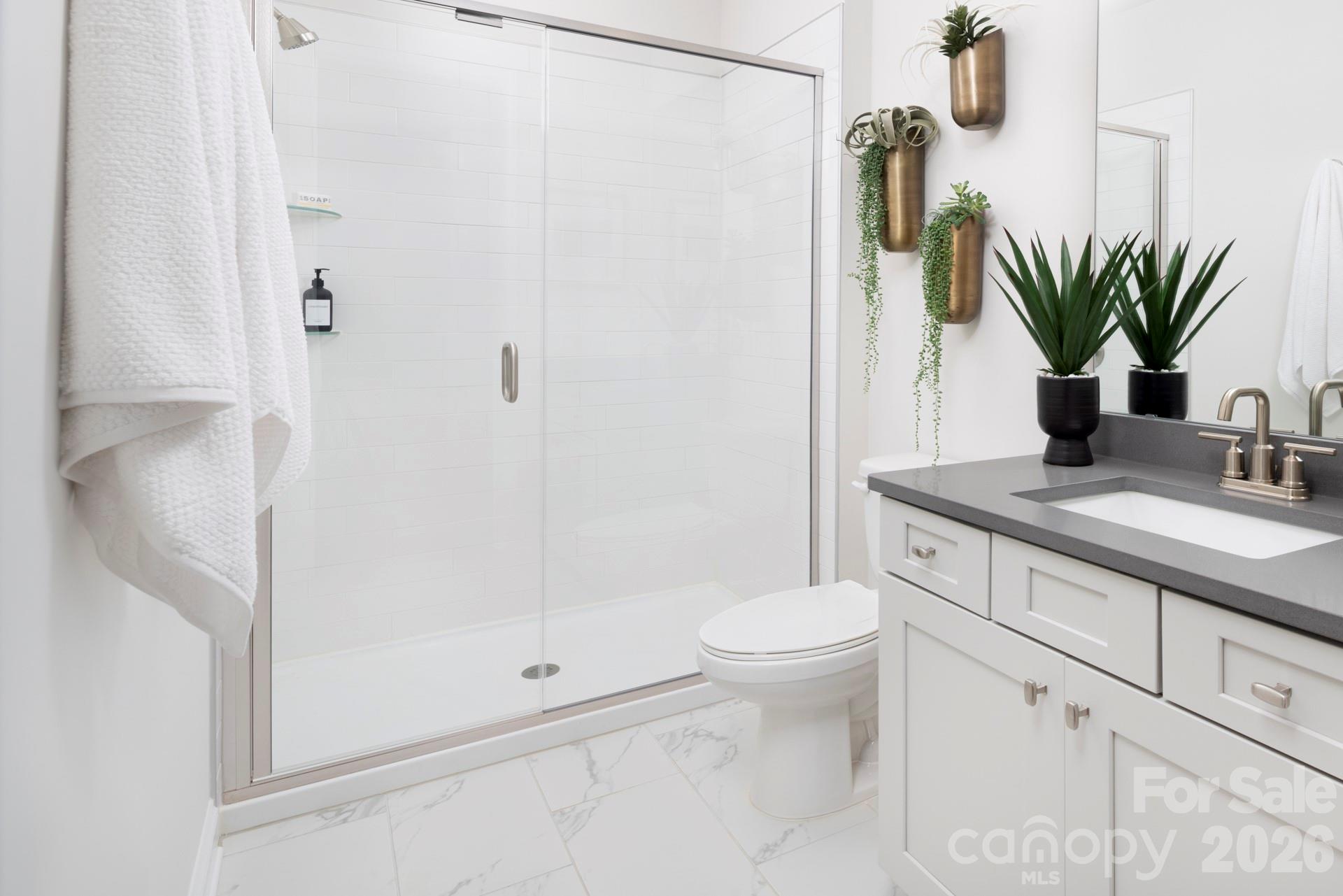 2532 Mabel Lane Monroe, NC 28110 - Photo 24 of 35 a bathroom with a granite countertop sink toilet and shower