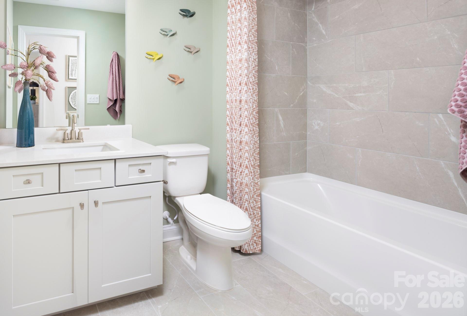 2532 Mabel Lane Monroe, NC 28110 - Photo 32 of 35 a bathroom with a sink a toilet and a bathtub