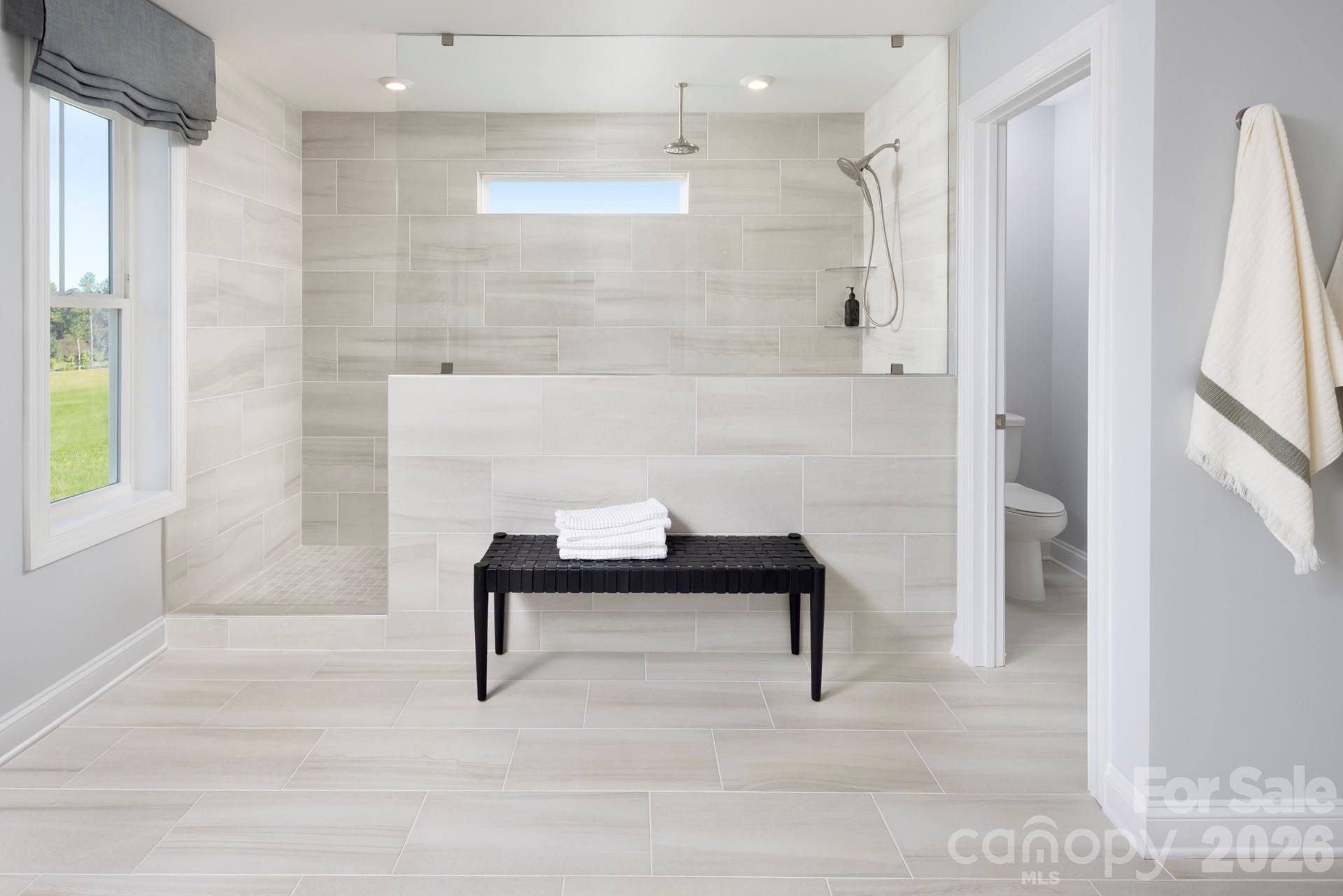 2532 Mabel Lane Monroe, NC 28110 - Photo 35 of 35 a bathroom with a bathtub and a shower