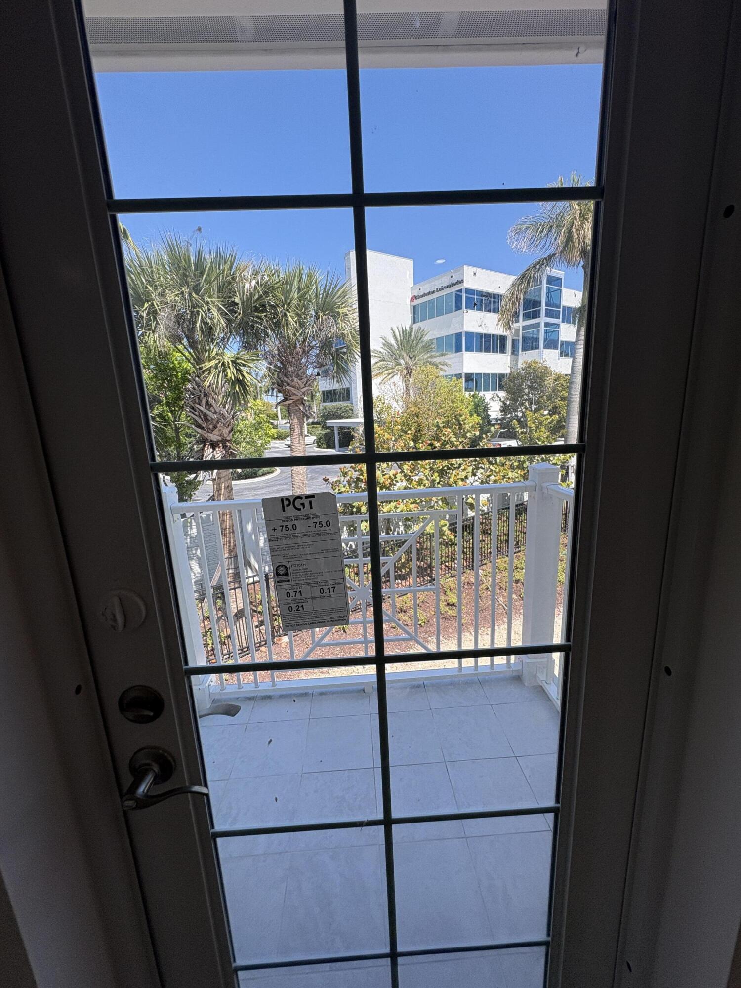 135 Water Pointe Place, Unit 22 Jupiter, FL 33477 - Photo 8 of 15 Primary Balcony Door