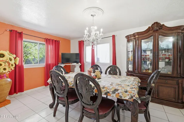 a kitchen with stainless steel appliances a stove a refrigerator and a refrigerator