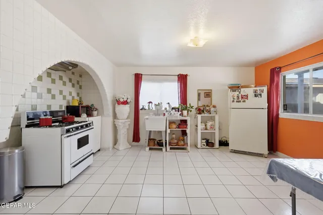 a view of a kitchen with furniture and window