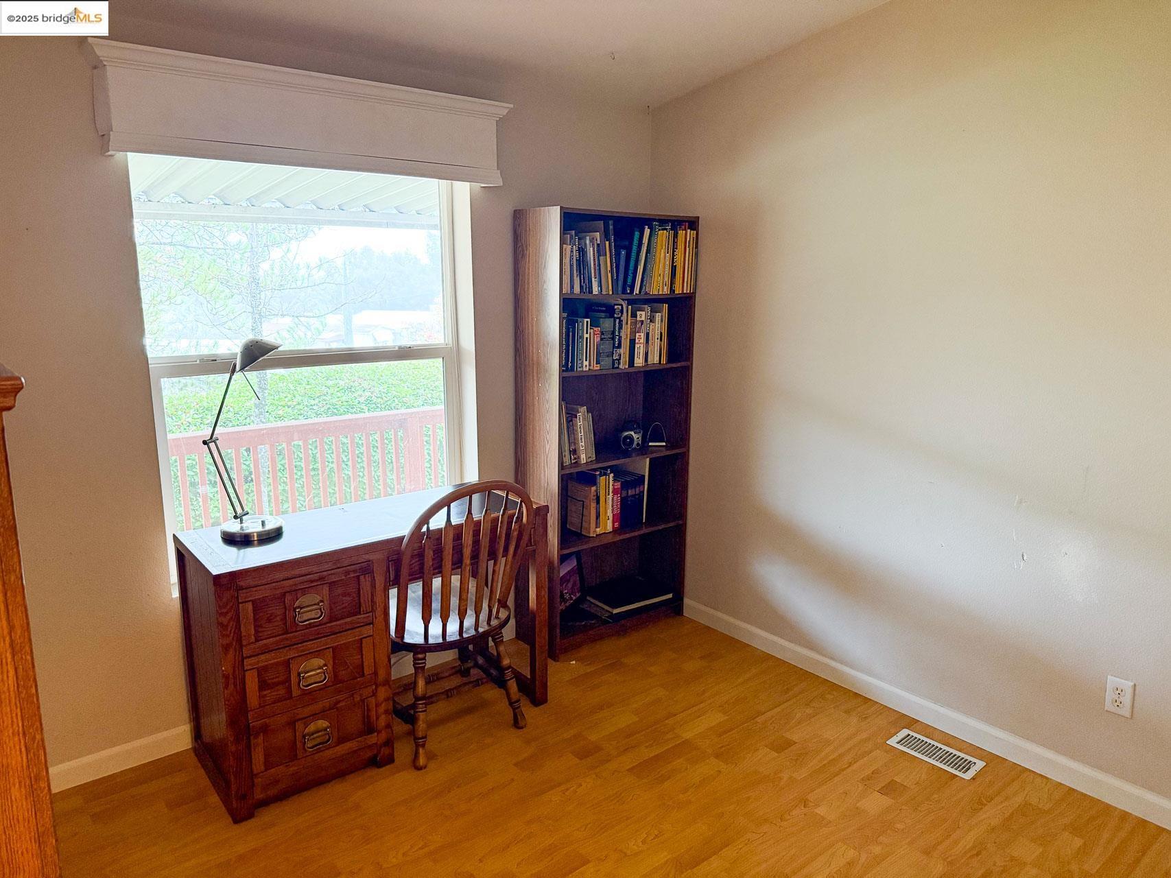 18717 Mill Villa Road, Unit 636 Jamestown, CA 95327 - Photo 15 of 24 a room with furniture window and book shelf