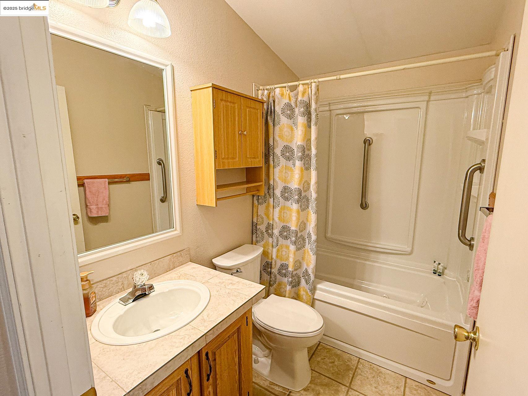 18717 Mill Villa Road, Unit 636 Jamestown, CA 95327 - Photo 17 of 24 a bathroom with a sink toilet and shower