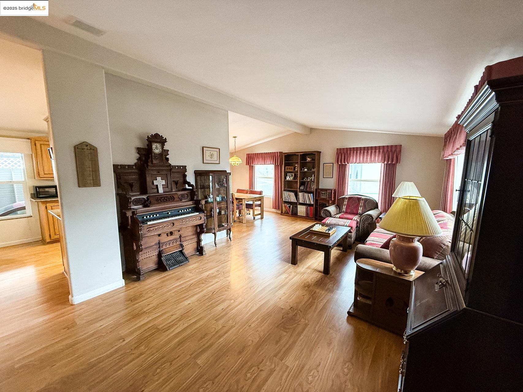 18717 Mill Villa Road, Unit 636 Jamestown, CA 95327 - Photo 4 of 24 a living room with furniture and wooden floor