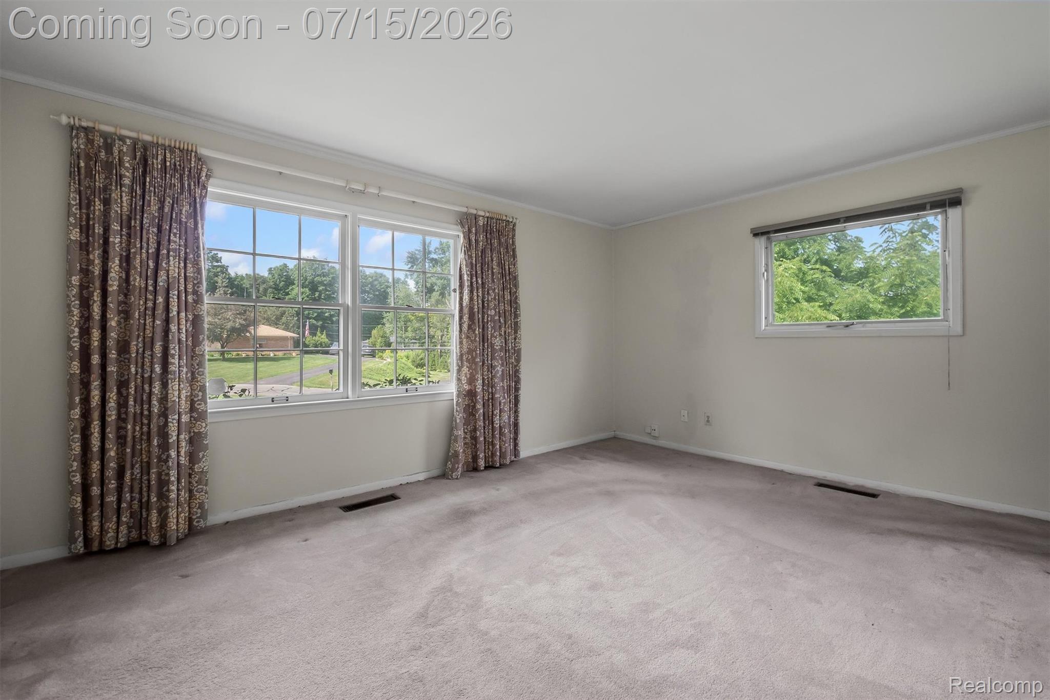 1151 Peveril Road Bloomfield Hills, MI 48304 - Photo 24 of 39 Expansive primary bedroom with a bright picture window and walk-in closet