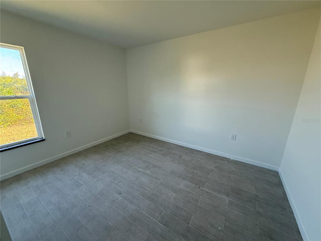 2164 Northland Avenue North Port, FL 34288 - Photo 17 of 31 an empty room with a window