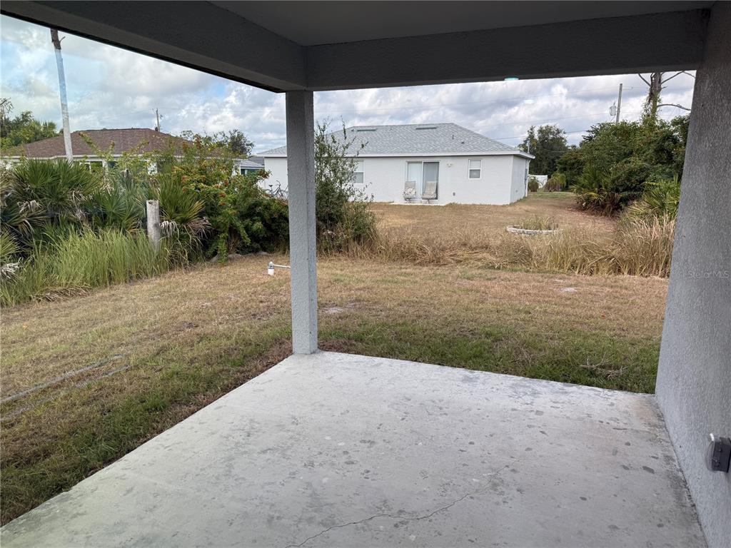 2164 Northland Avenue North Port, FL 34288 - Photo 22 of 31 a view of a house with porch and a yard