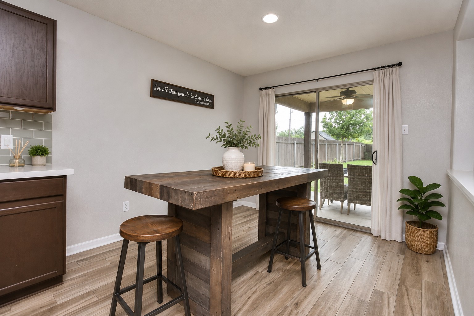 74 Jan Lane Georgetown, TX 78626 - Photo 18 of 36 A wooden breakfast bar provides an inviting space for casual dining, leading to a fenced backyard patio. (virtually staged)
