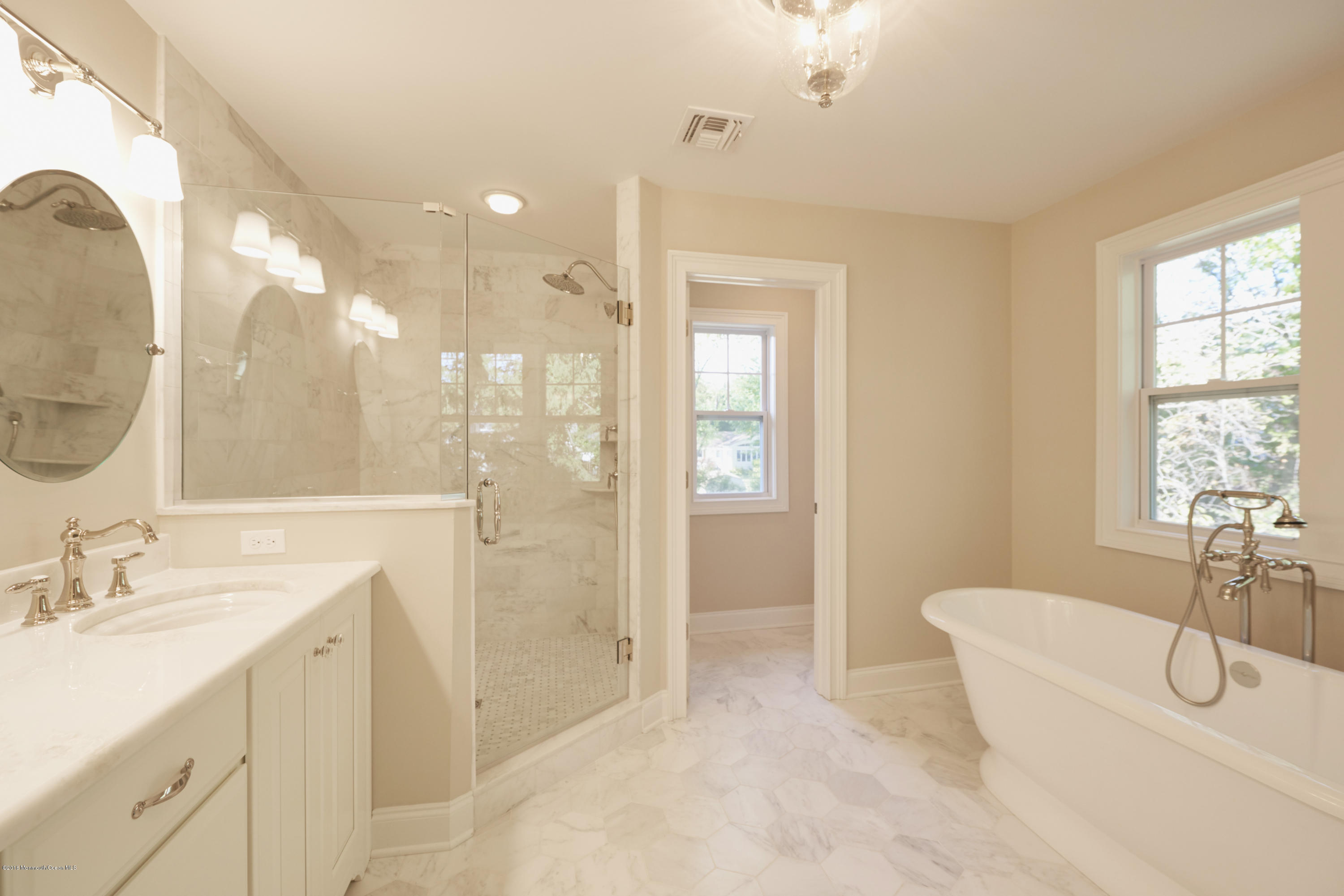 17 Cardinal Road Middletown, NJ 07748 - Photo 15 of 22 a spacious bathroom with a double vanity sink a large mirror and shower