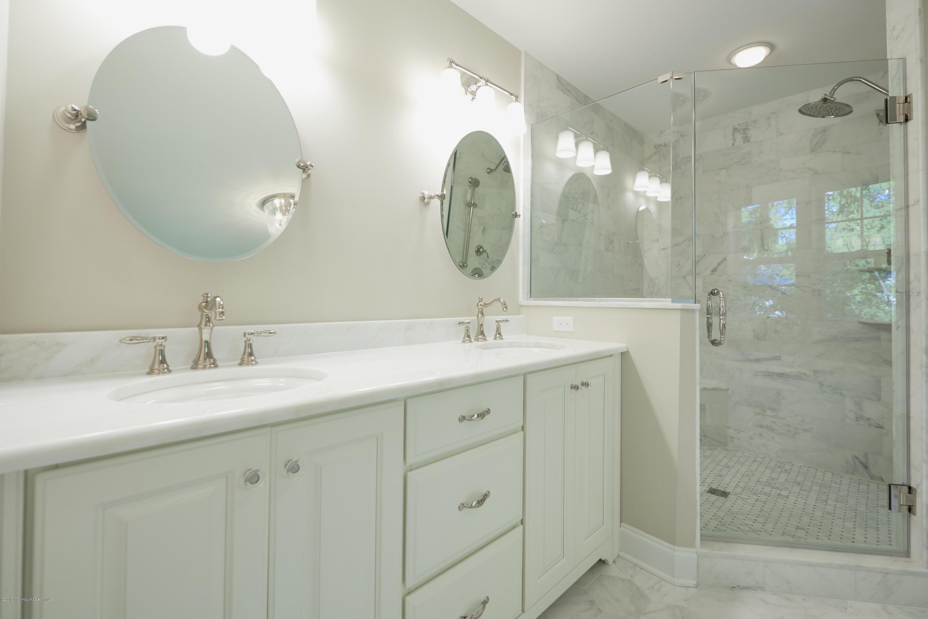 17 Cardinal Road Middletown, NJ 07748 - Photo 17 of 22 a bathroom with a double vanity sink mirror and shower