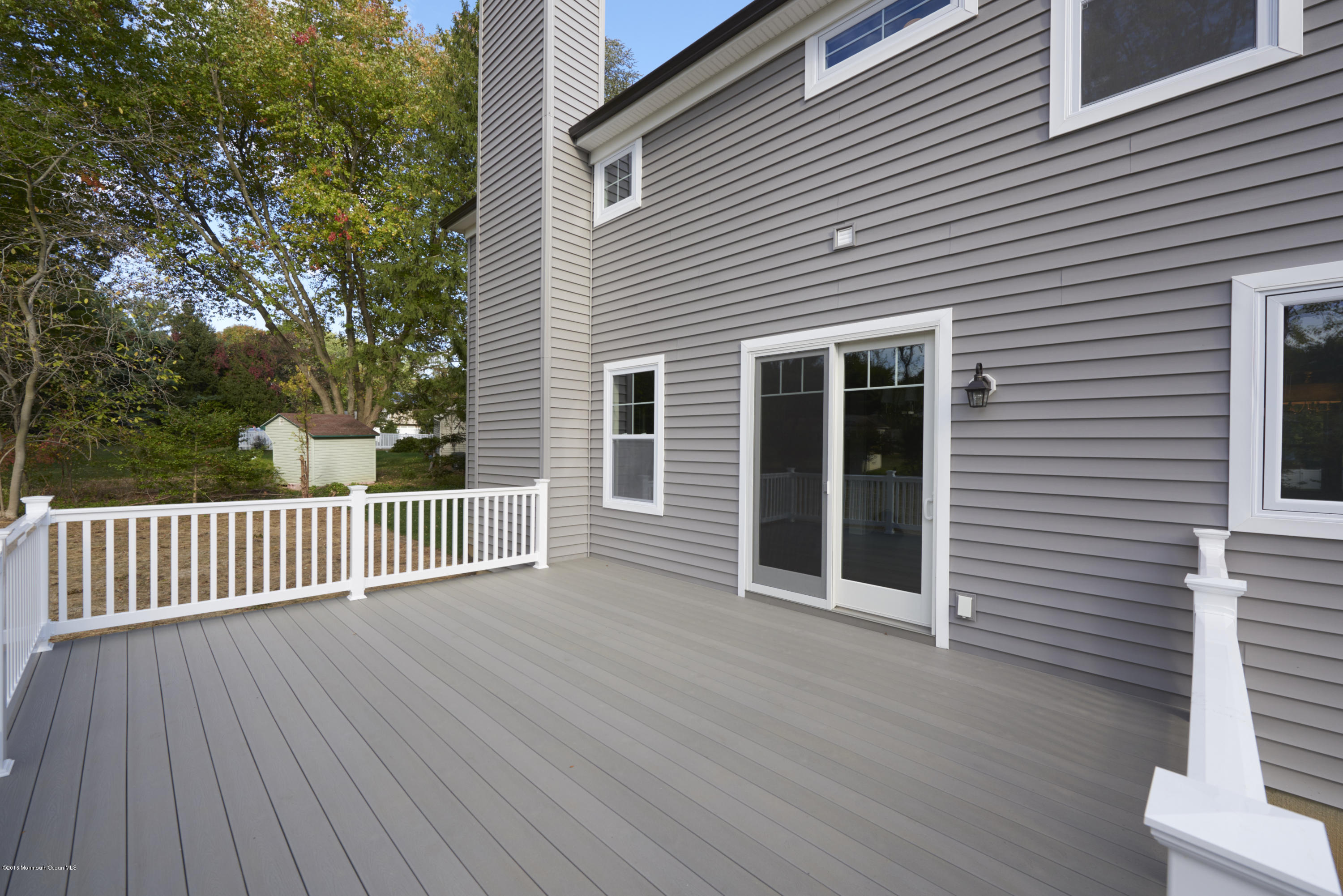 17 Cardinal Road Middletown, NJ 07748 - Photo 21 of 22 a view of backyard with deck and wooden floor