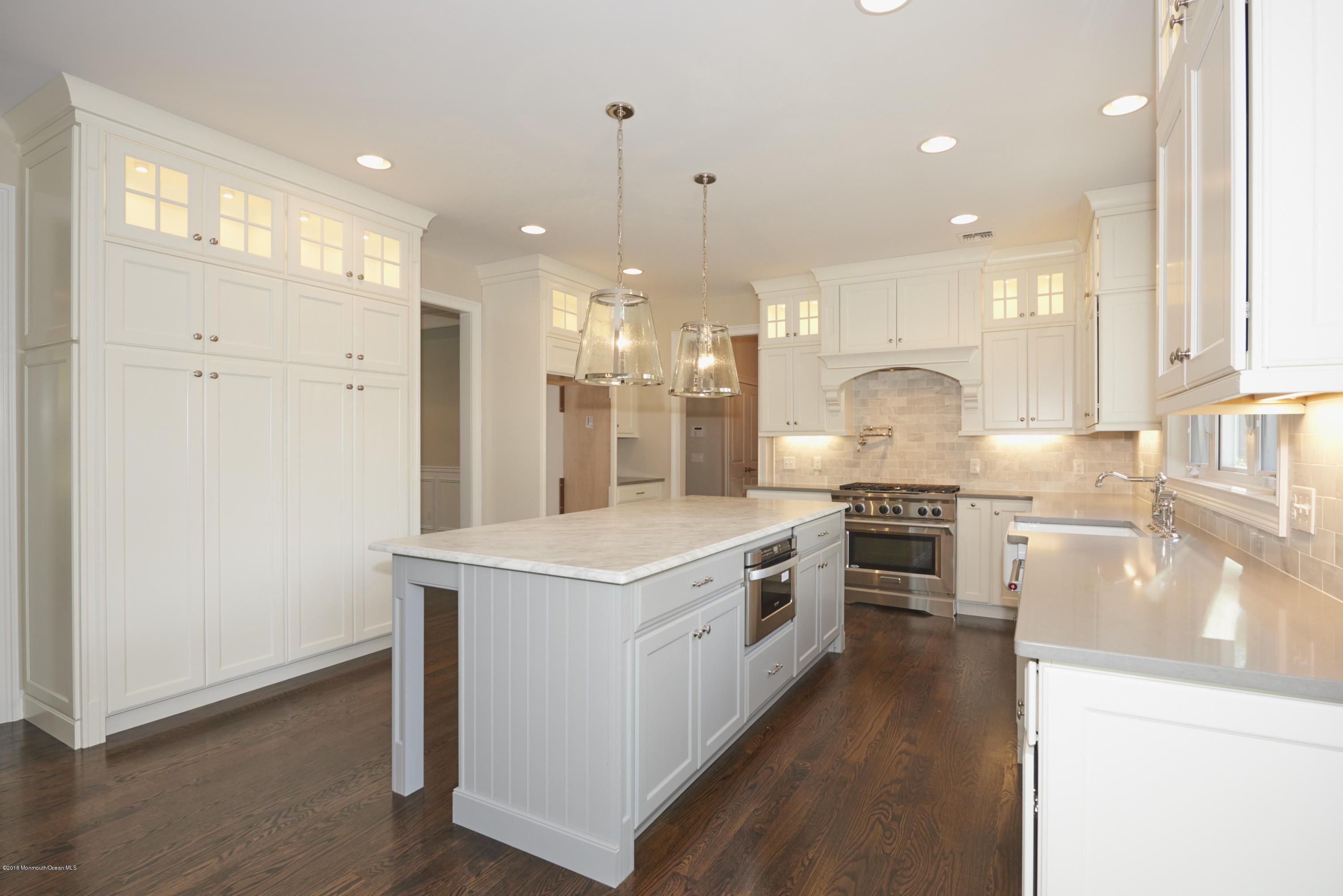 17 Cardinal Road Middletown, NJ 07748 - Photo 9 of 22 a large kitchen with stainless steel appliances granite countertop a stove a sink and a refrigerator
