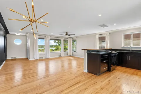 a kitchen with granite countertop a stove and a refrigerator