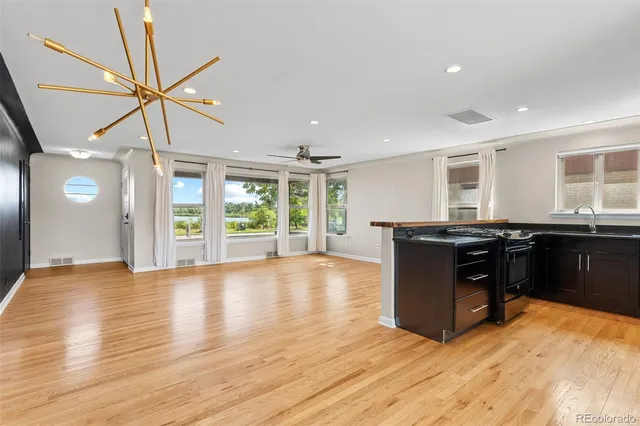 a kitchen with granite countertop a stove and a refrigerator