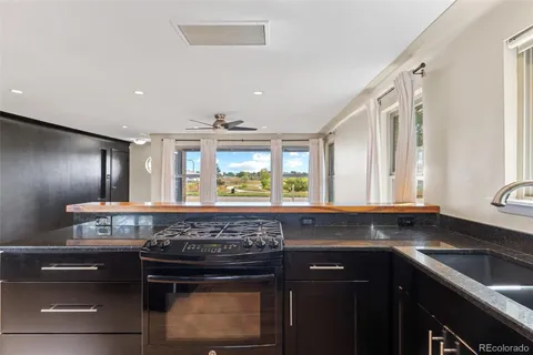 a kitchen with a stove and a sink