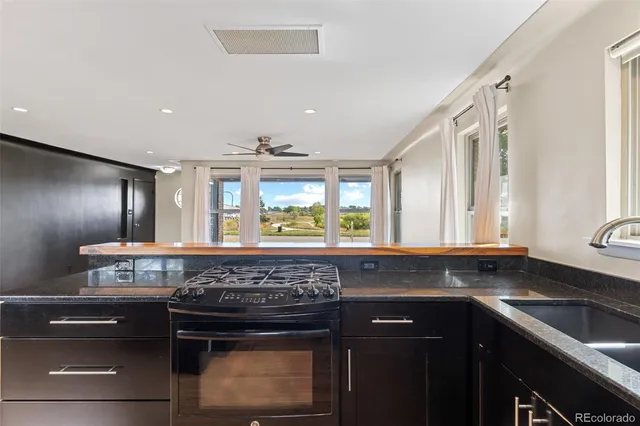 a kitchen with a stove and a sink